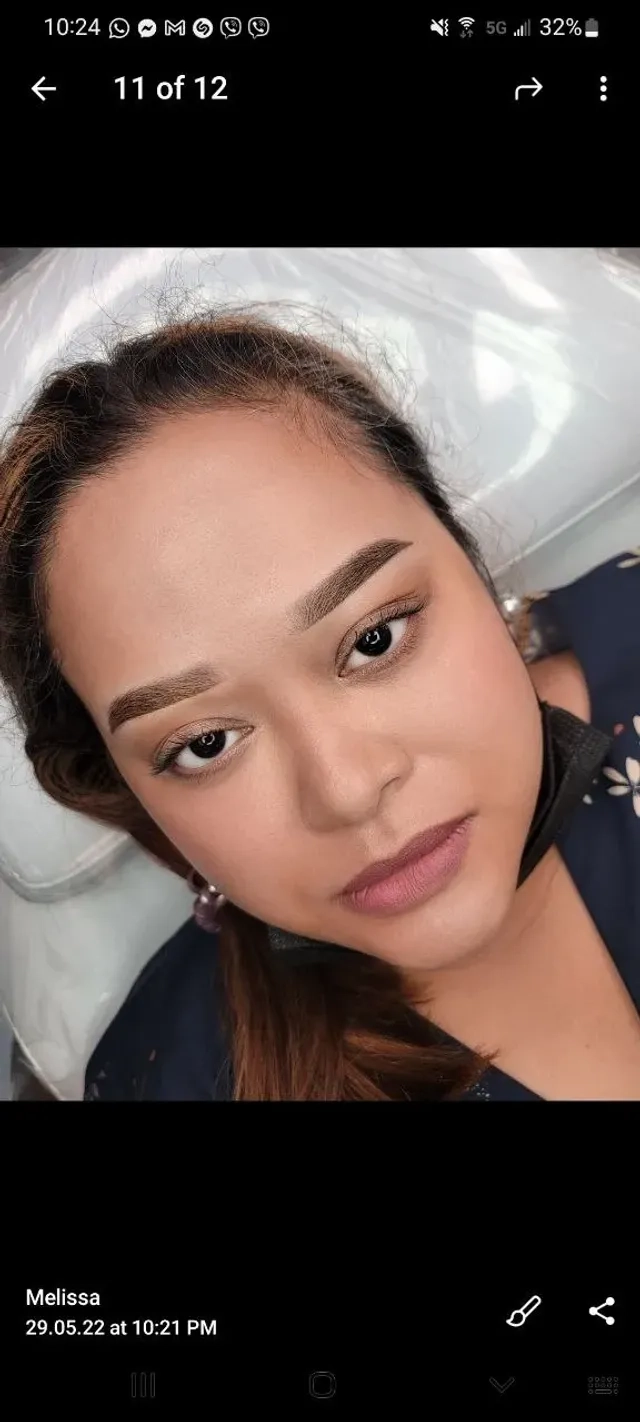 Woman After Eyebrow Microblading Procedure