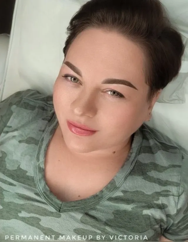 Woman showcasing permanent makeup results